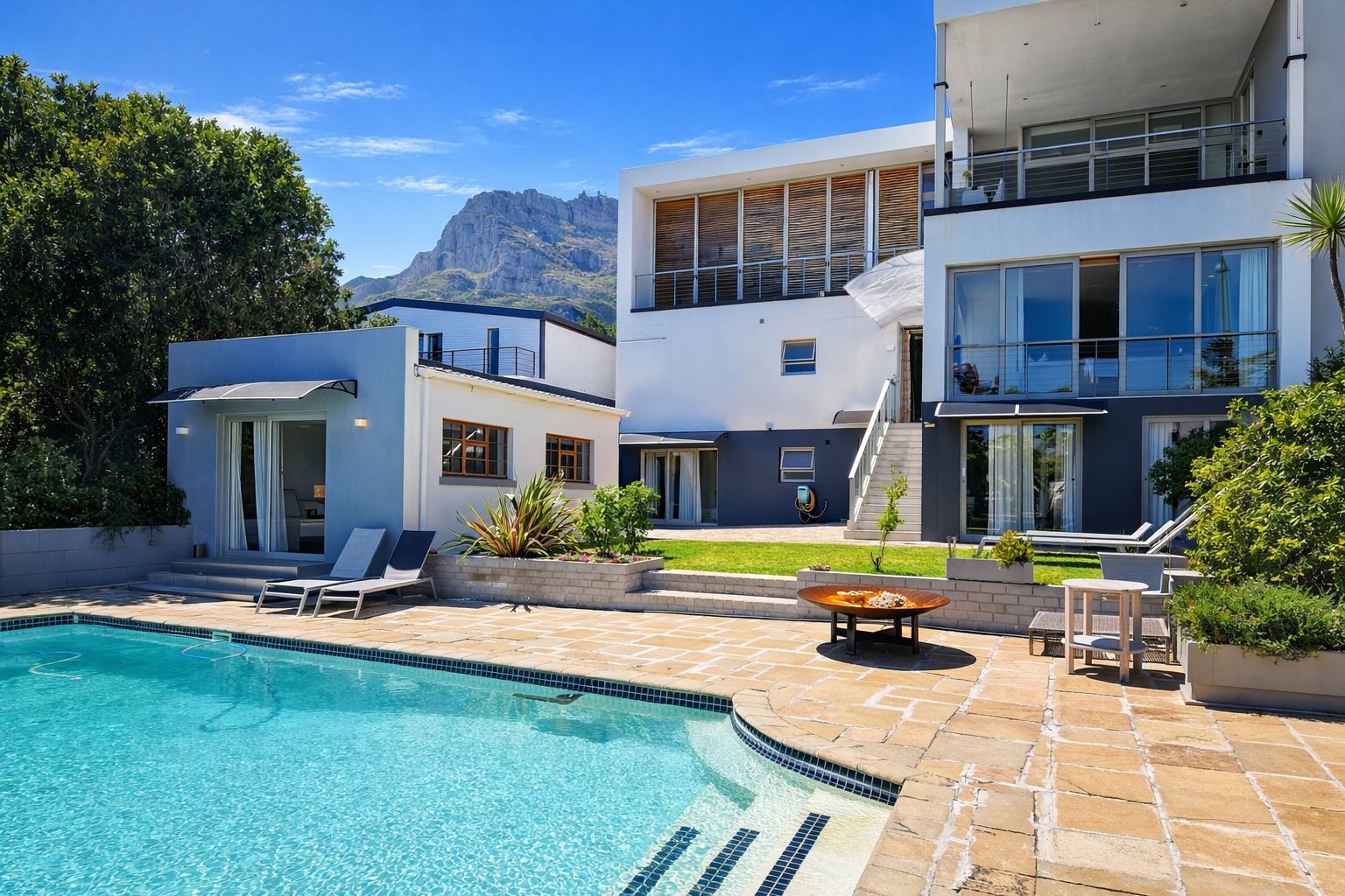 Pool deck and sun loungers with the Twelve Apostles behind